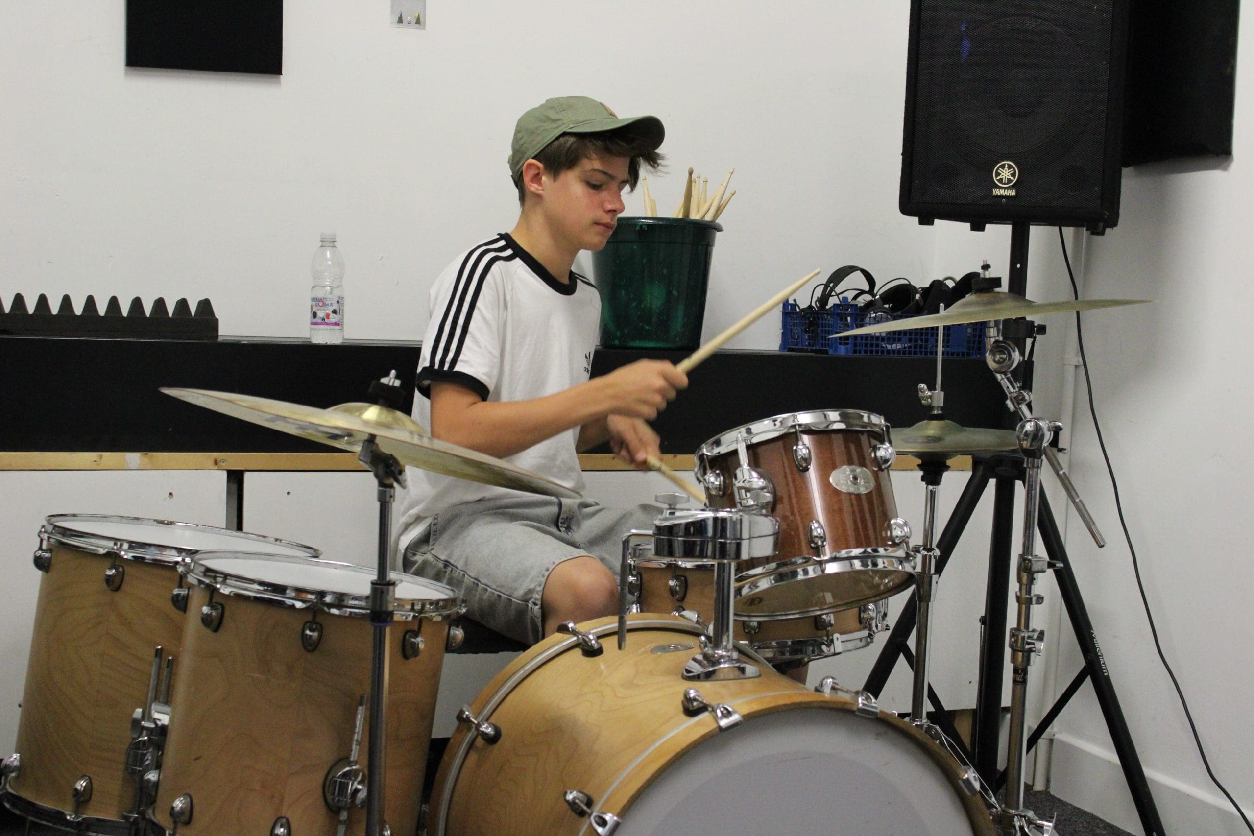 Boy playing the drums, learning percussion at Folkestone Music Centre