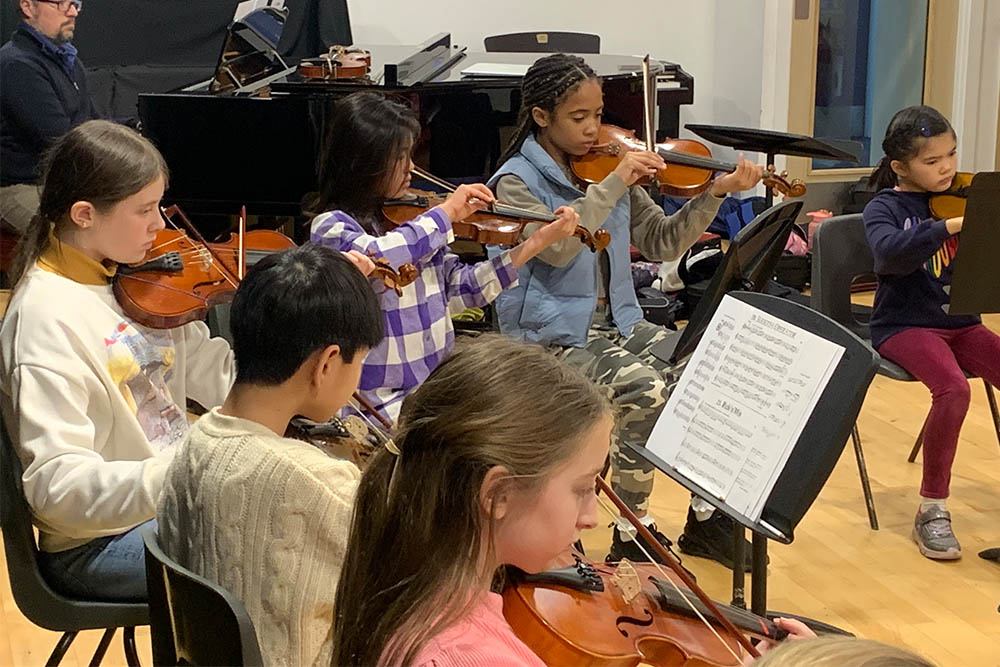 Young musicians rehearsing together with the Allegro Strings group in Gravesham Music Centre