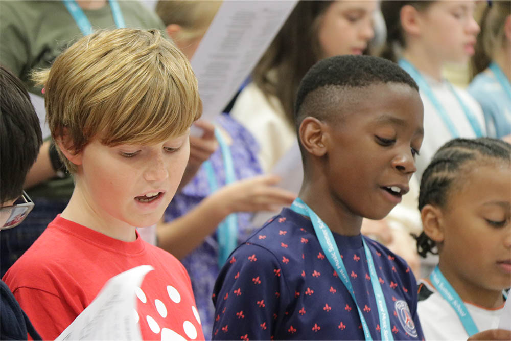 Young boys singing together with Gravesham Junior Choir