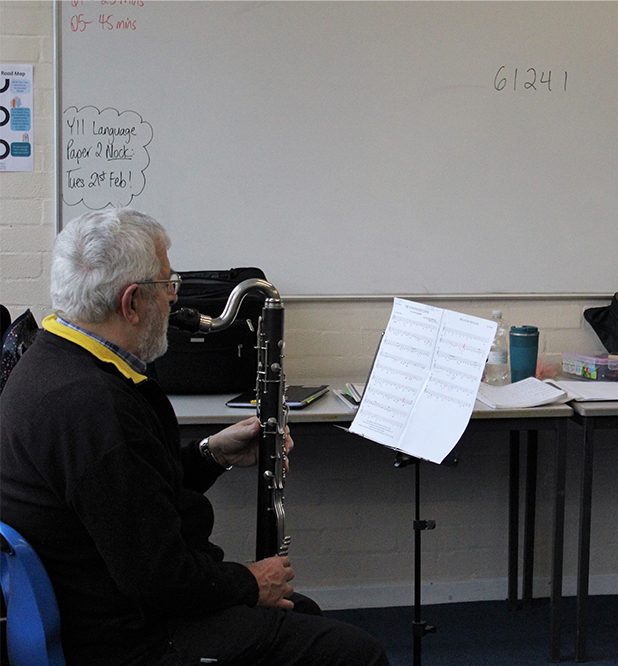 Bass clarinetist playing with the Adult Clarinet Ensemble in Medway
