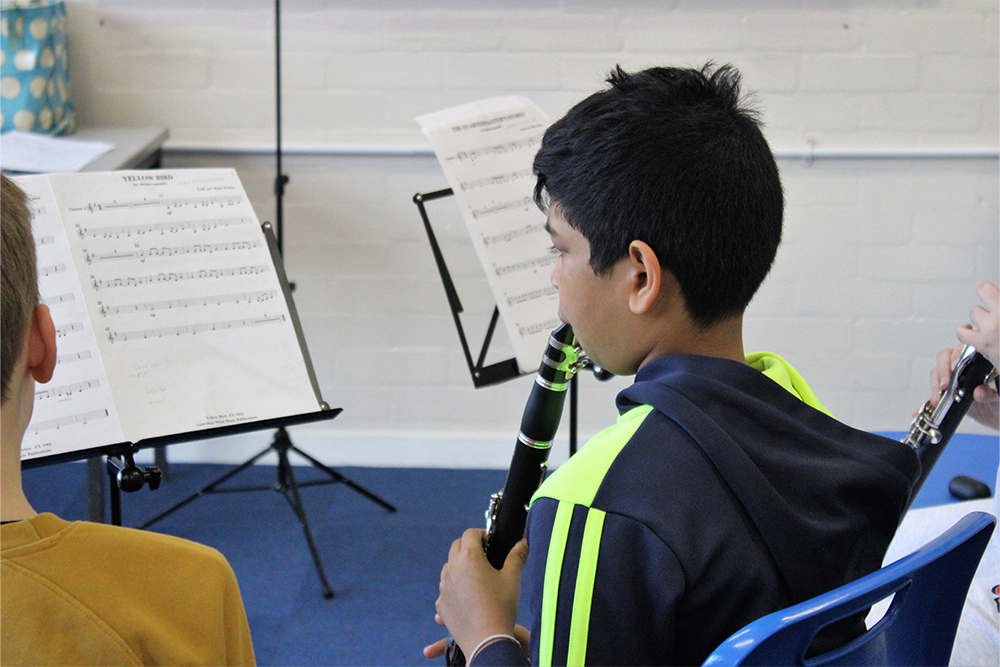 Boy playing clarinet in ensemble with Medway Towns Music Centre, Junior Clarinet Ensemble Group