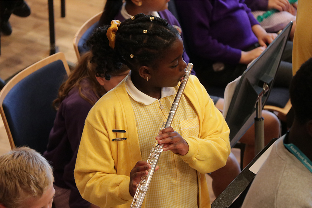 Young flautist rehearsing with the Medway Junior Flute Ensemble