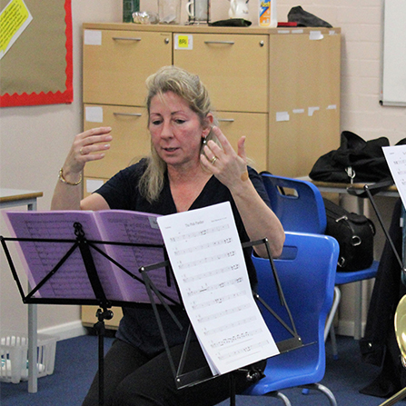 Conductor Angela Love leading the Junior Wind Band