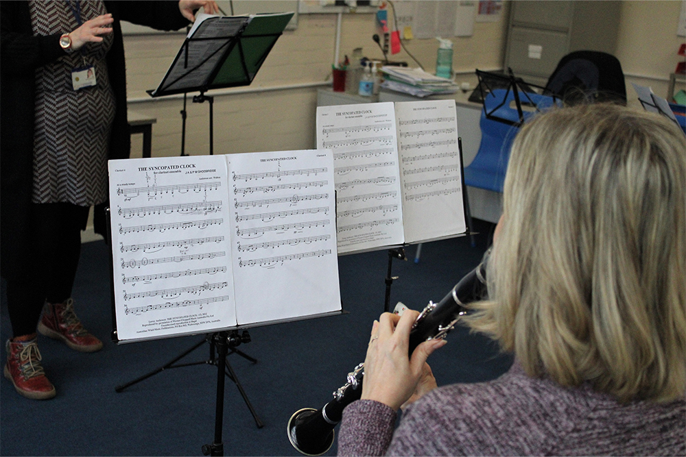 Woman playing the clarinet with the Adult Clarinet Ensemble in Medway