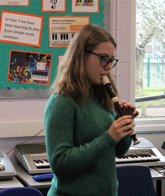 Girl learning to play the recorder at Kent Music Medway Towns Music Centre Senior Recorders Group
