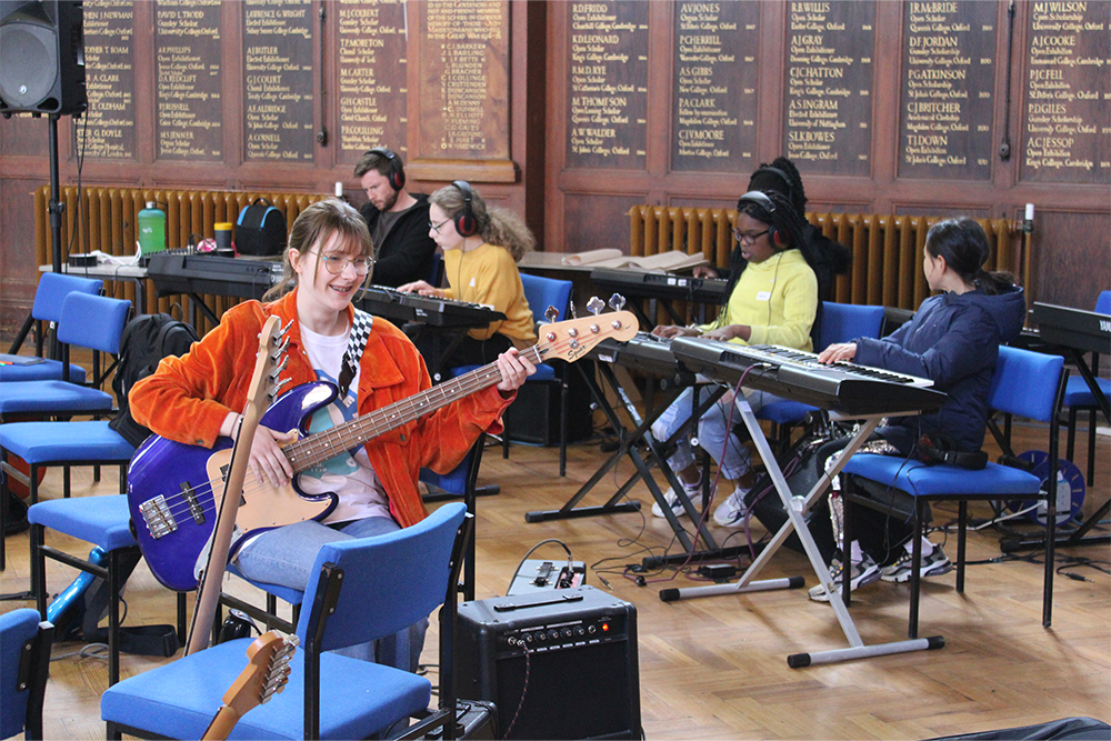 Young musicians playing music together in Orchestra One