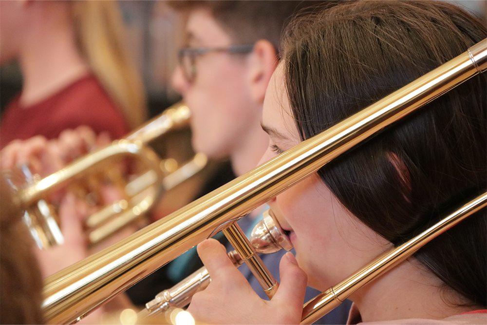 Girl playing trombone in Kent Music Sevenoaks Music Centre West Kent Brass Band