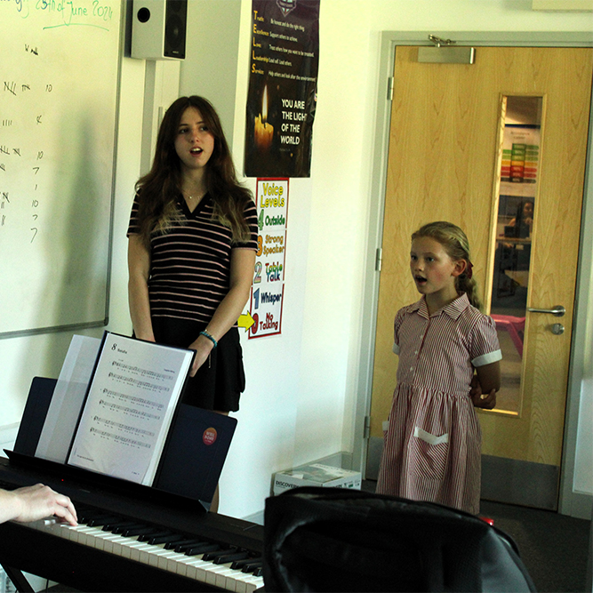 Girls learning to sing in Kent Music Sevenoaks Music Centre West Kent Junior Voices