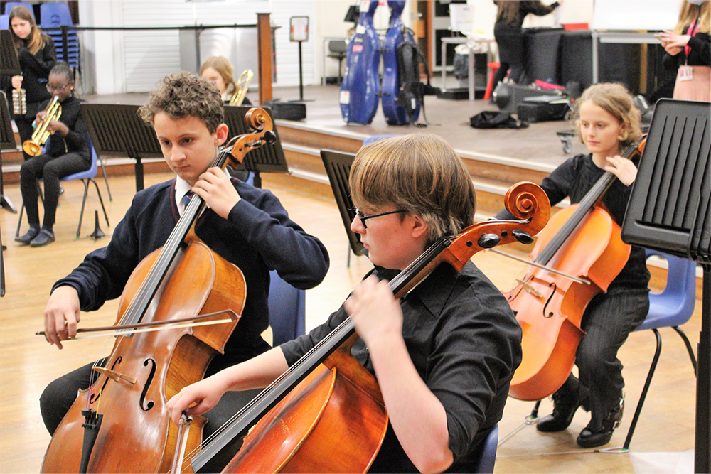 Students performing together with West Kent Youth Orchestra at Tonbridge Music Centre