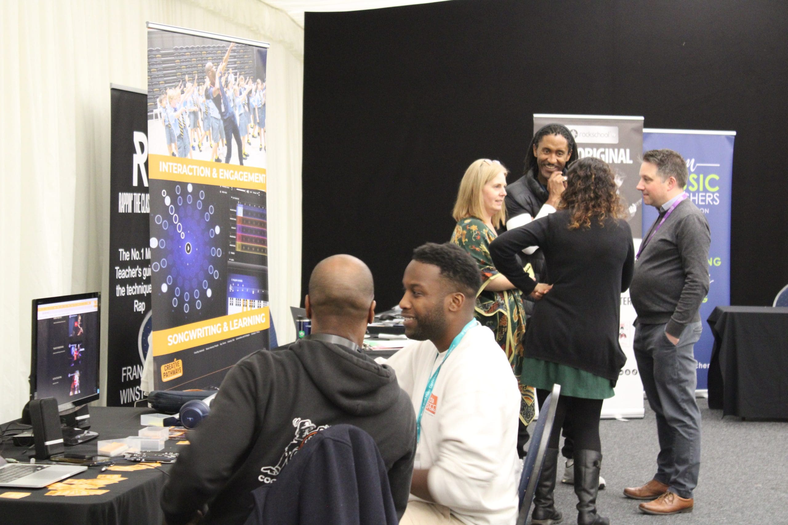 People engaging in activities at the Kent and Medway Conference for Kent Music